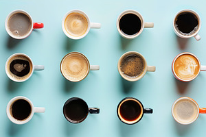 Flat lay of different cups of coffee on blue background, a Food & Drink Photo by AlyaAnd