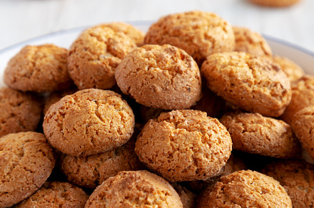 Homemade Sweet and Crunchy Amaretti on a Plate, side view. Close, a Food & Drink Photo by LiudmylaChuhunova