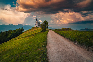 Saint Primoz church at sunset, an Architecture Photo by Alpine Dreams