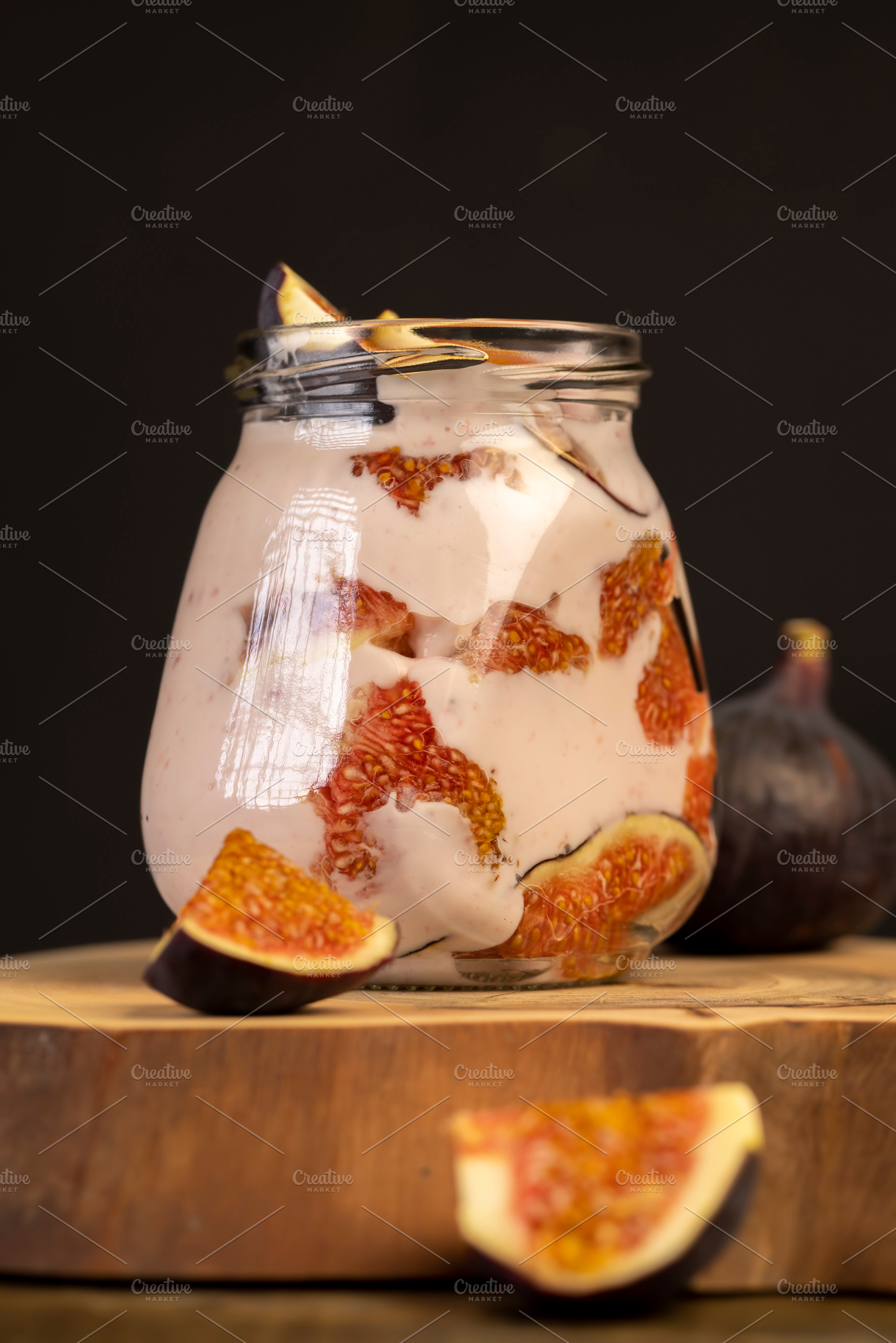 glass jar with fresh yogurt with ripe fresh figs, a Photo by rsoollAI