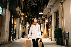 Woman holding bags featuring woman, girl, and bags