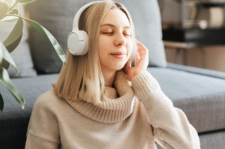 Young caucasian woman relaxes at home with music, a Person Photo by Olena Rudo