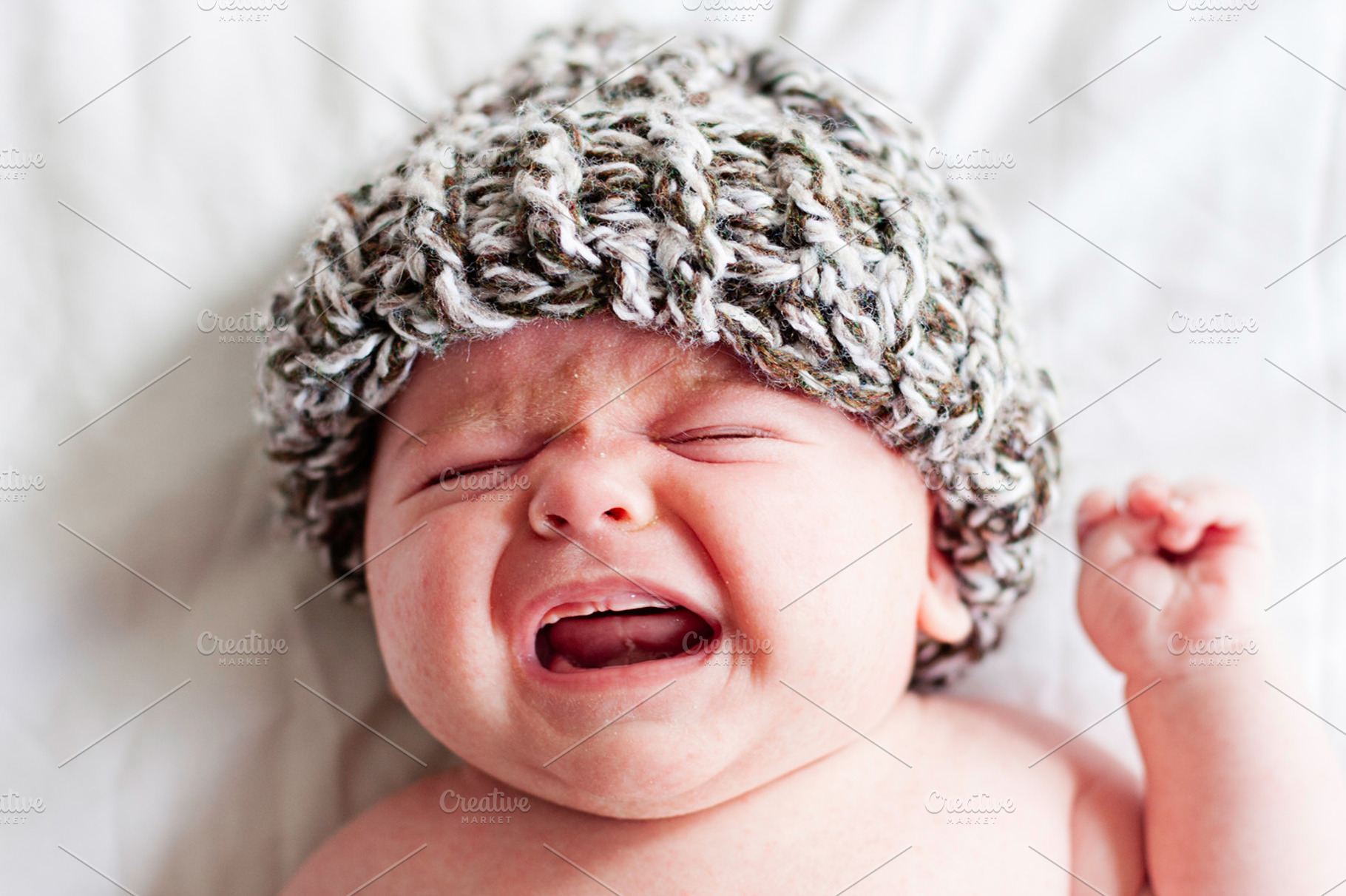 Crying newborn baby featuring baby, sad, and crying