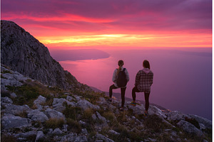 Two women hikers with backpacks, a Nature Photo by den-belitsky