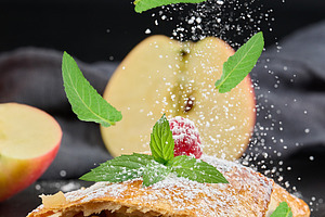 A delicious slice of apple strudel with powdered sugar sprinkled, a Food & Drink Photo by ndanko