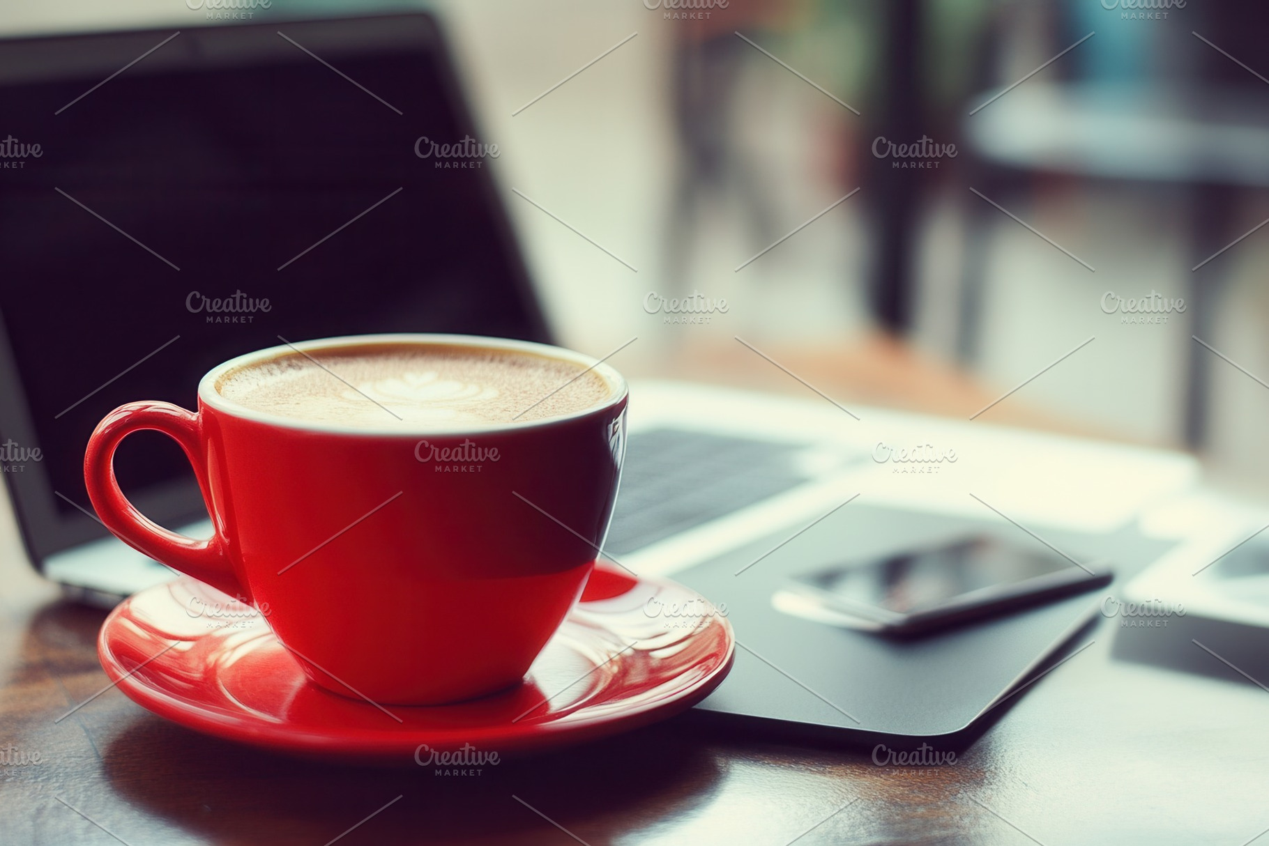 Red coffee cup placed on a table, a Photo by Pavel_design