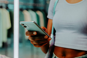 woman paying with phone at store, generative AI, a Photo by Nito