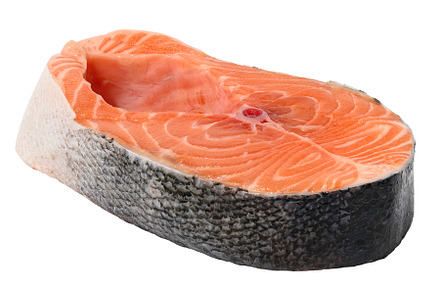 Raw salmon steak on a white isolated background, a Food & Drink Photo by ndanko