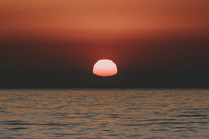sun melting into the ocean