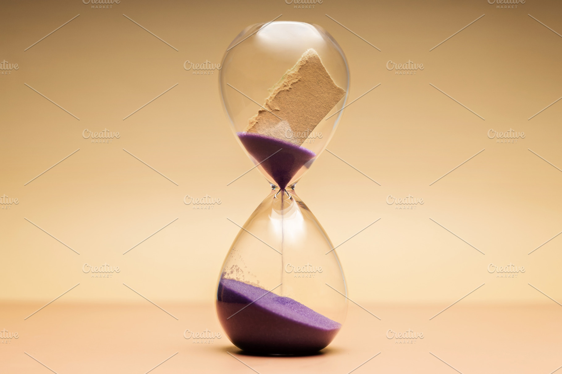 Hourglass with torn paper message, storytelling, unfinished memo, a Photo by salmon.black