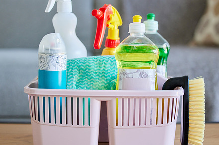 Cleaning supplies, brush and basket tools on table in home living room for hygiene. Cleaning products, spring cleaning and equipment for creating germ free living space, sanitizing or washing., a Photo by Peopleimages.com