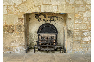 Cast iron fireplace and grate in, an Architecture Photo by Backyard Stock