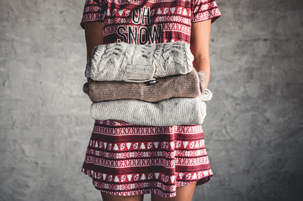 A girl in a Christmas dress holds, a Beauty & Fashion Photo by OS