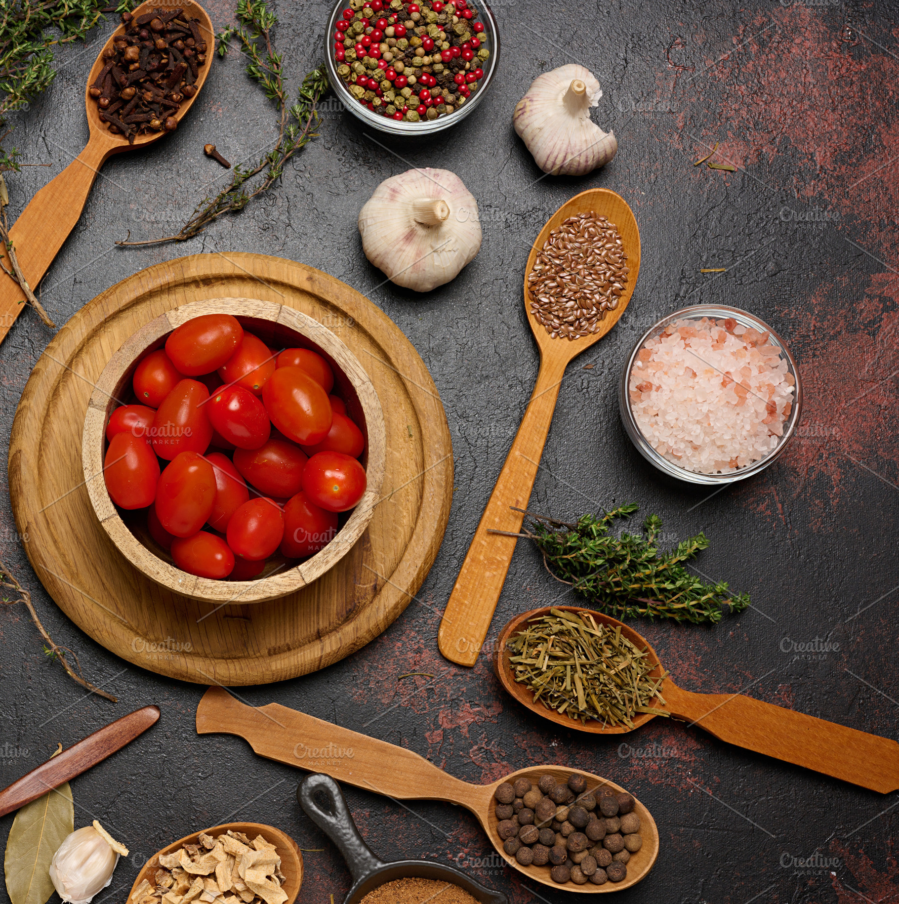 Spices in spoons and bowls on a dark background. Cooking ingredi, a Food & Drink Photo by ndanko