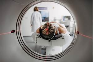 CT scanner view of patient during, a Person Photo by HalfPoint