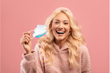 Coronavirus is over. Happy young, a Person Photo by Prostock-Studio