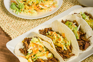 Pork tacos on a white serving plate stock photo containing food and baked