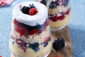 Trifle dessert with berries and cream on blue background, a Food & Drink Photo by etorres69