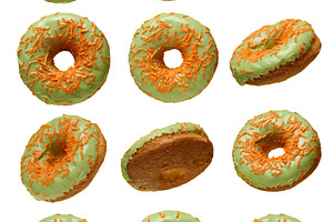 Green glazed donuts, each topped with orange sprinkles, presente, a Food & Drink Photo by ndanko