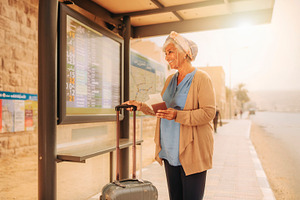 Senior woman waiting for public transportation