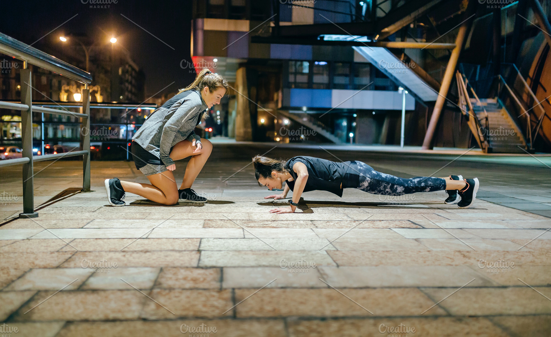 Woman doing push ups by supervision of personal trainer on the c, a Sports & Recreation Photo by davidpereiras
