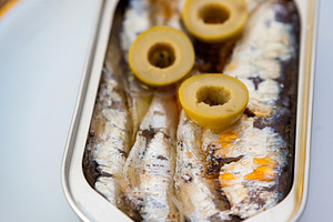Can of canned oil sardines on a elegant plate, a Food & Drink Photo by José Manuel Gelpi