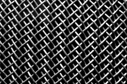 Monochrome texture of a shiny metal colander or grate. Abstract, an Abstract Photo by Eugene_Photo