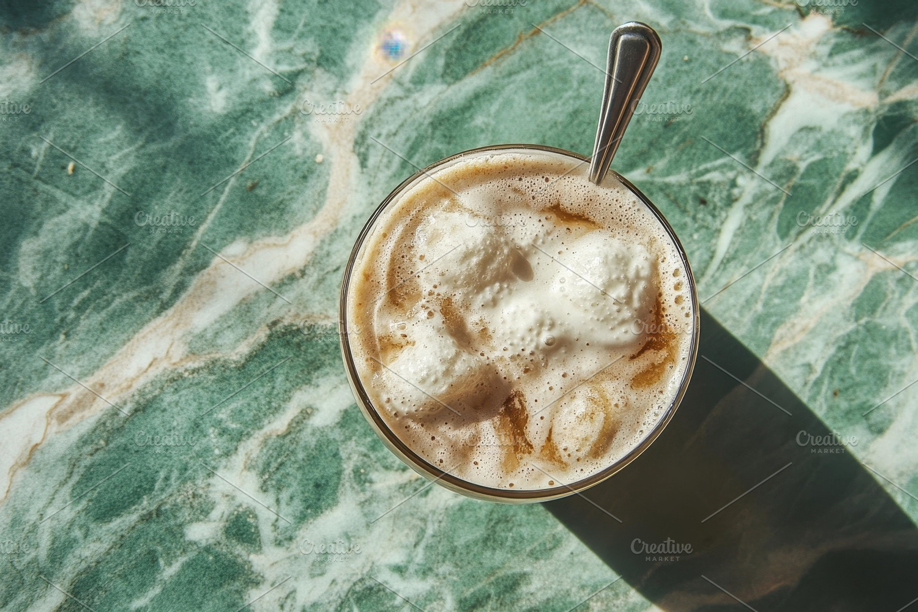 Creamy coffee drink served in a glas, a Photo by Tanuart