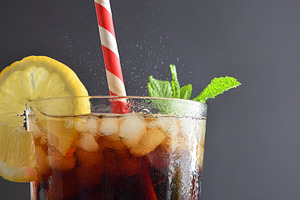 Refreshing drink with ice, mint and lemon isolated on grey, a Food & Drink Photo by Davizro's Market