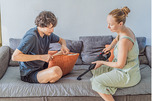Woman and man cleaning their home, a Person Photo by Elizaveta Galitskaya