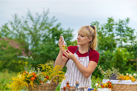 Woman with medicinal herbs and, a Nature Photo by yanadjana