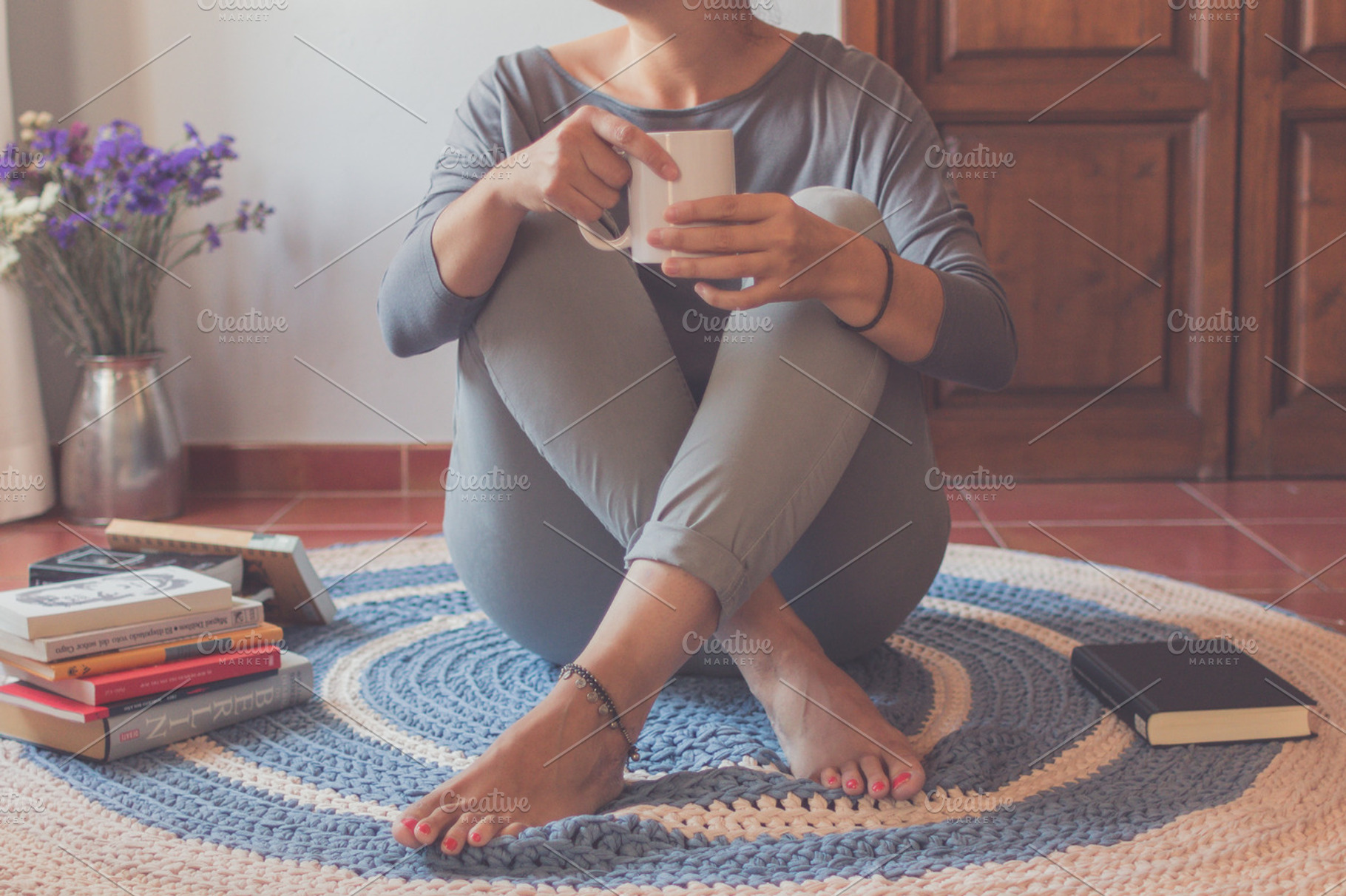 Relax over the blue and beige carpet, a Person Photo by Tan Tranquila