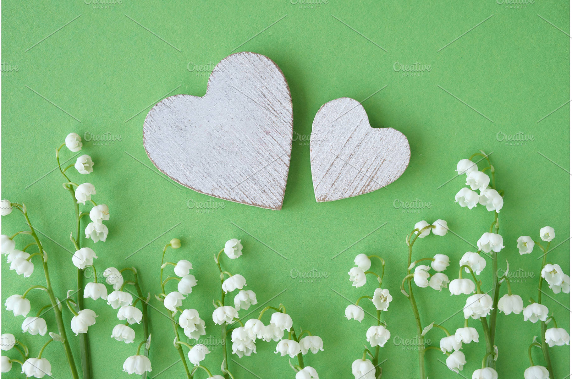 Two wooden hearts with white lily of, a Photo by tilialucida