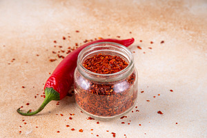 Powder or flakes red chili pepper, a Food & Drink Photo by Rimma