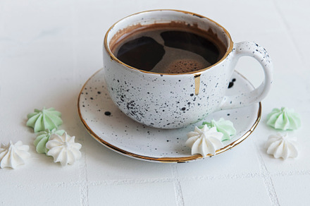 Cup with coffee and small meringues, a Food & Drink Photo by Olena Rudo