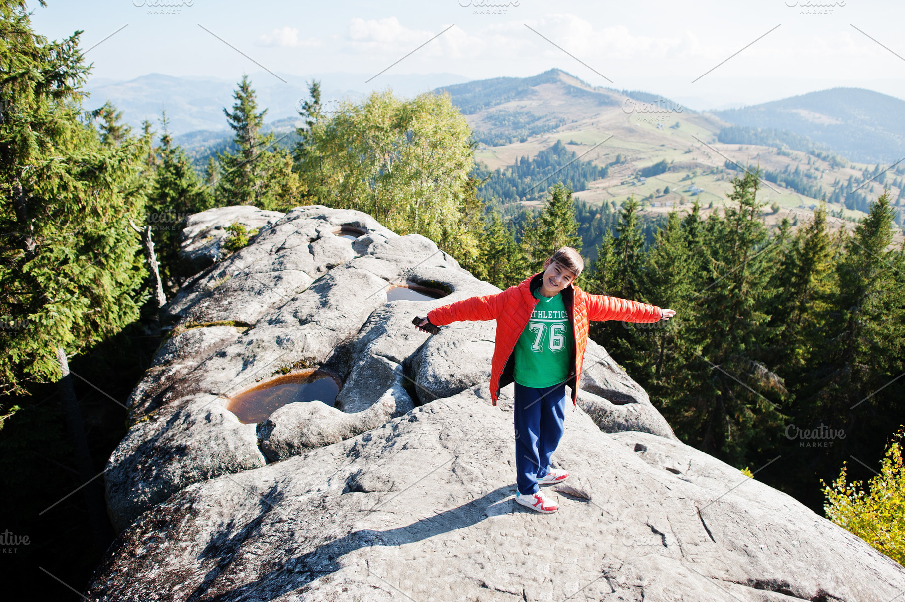 Boy on top of mountain. Children hiking on beautiful day in moun, a Nature Photo by AS photostudio