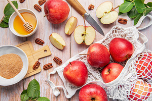 Red apples, honey, pecans, cinnamon for autumn baking, a Food & Drink Photo by Olena Rudo
