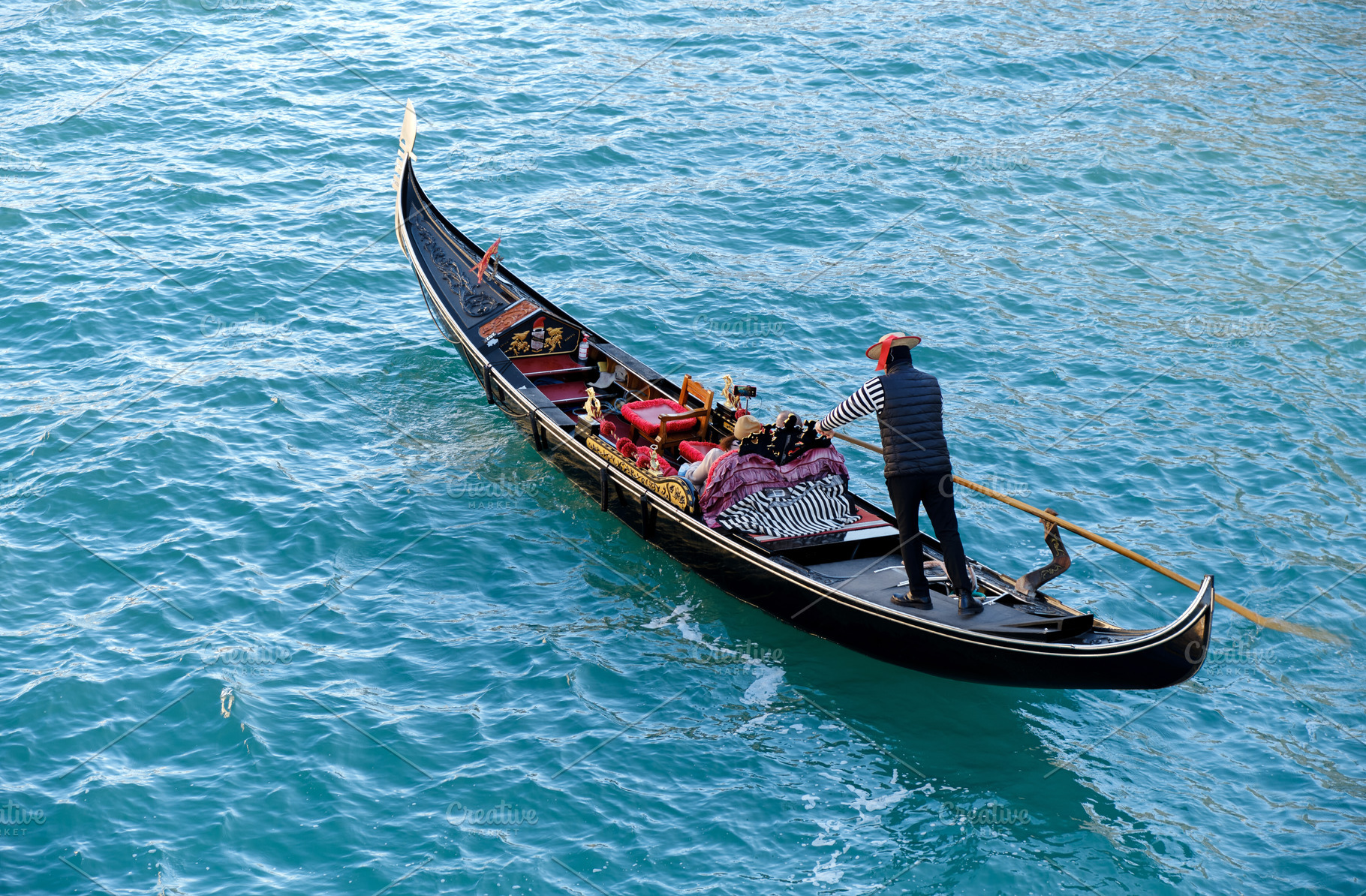 Gondolier in gondola in Venice, a Transportation Photo by BOOCYS