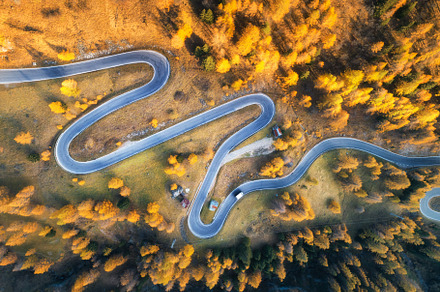 Aerial view of the winding road containing road, aerial, and view, a Transportation Photo by den-belitsky