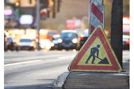 Workers fixing the road with sign, an Industrial Photo by Barcelona_dreams