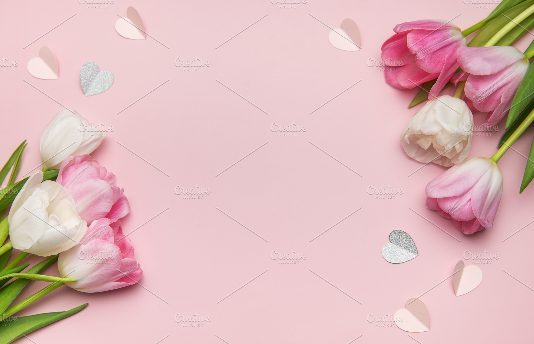 Pink and white tulips forming a border with paper hearts on a pi, a Holiday Photo by Olena Rudo