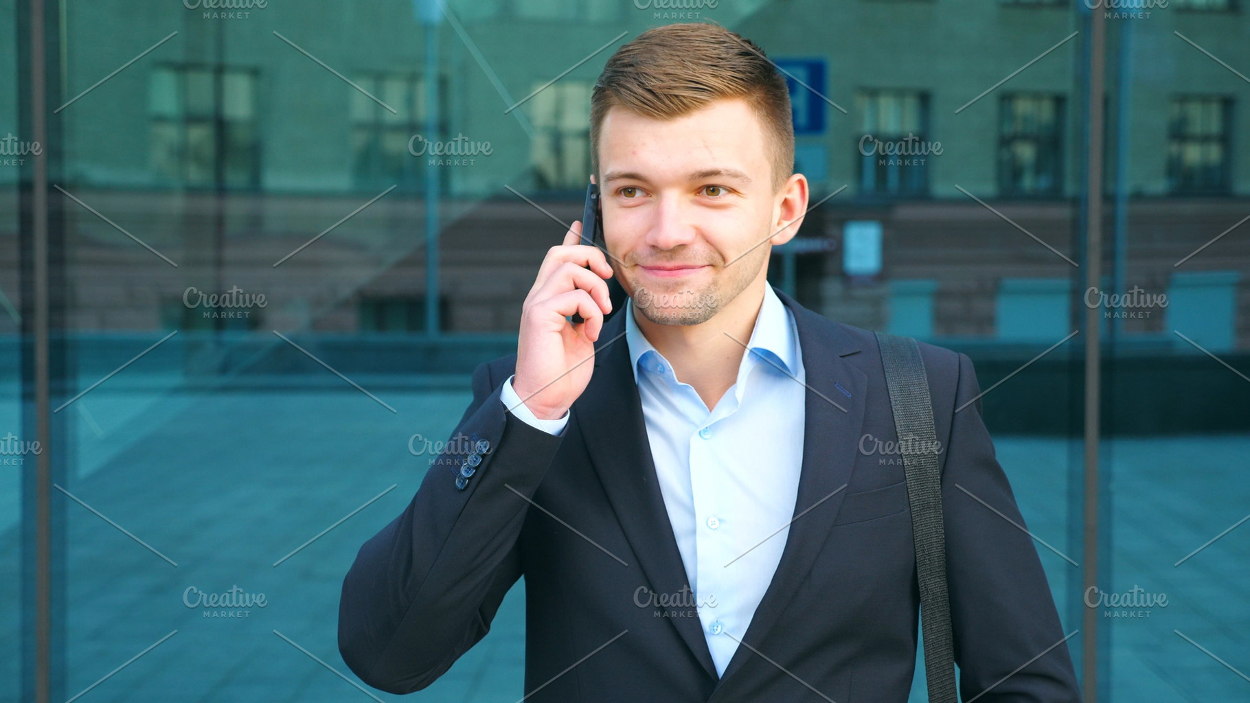 Young businessman talking on phone featuring phone, conversation, and talk, a Person Photo by Footage Autor