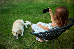 Young girl takes selfie in garden, a Nature Photo by IlliaBondarPhotography