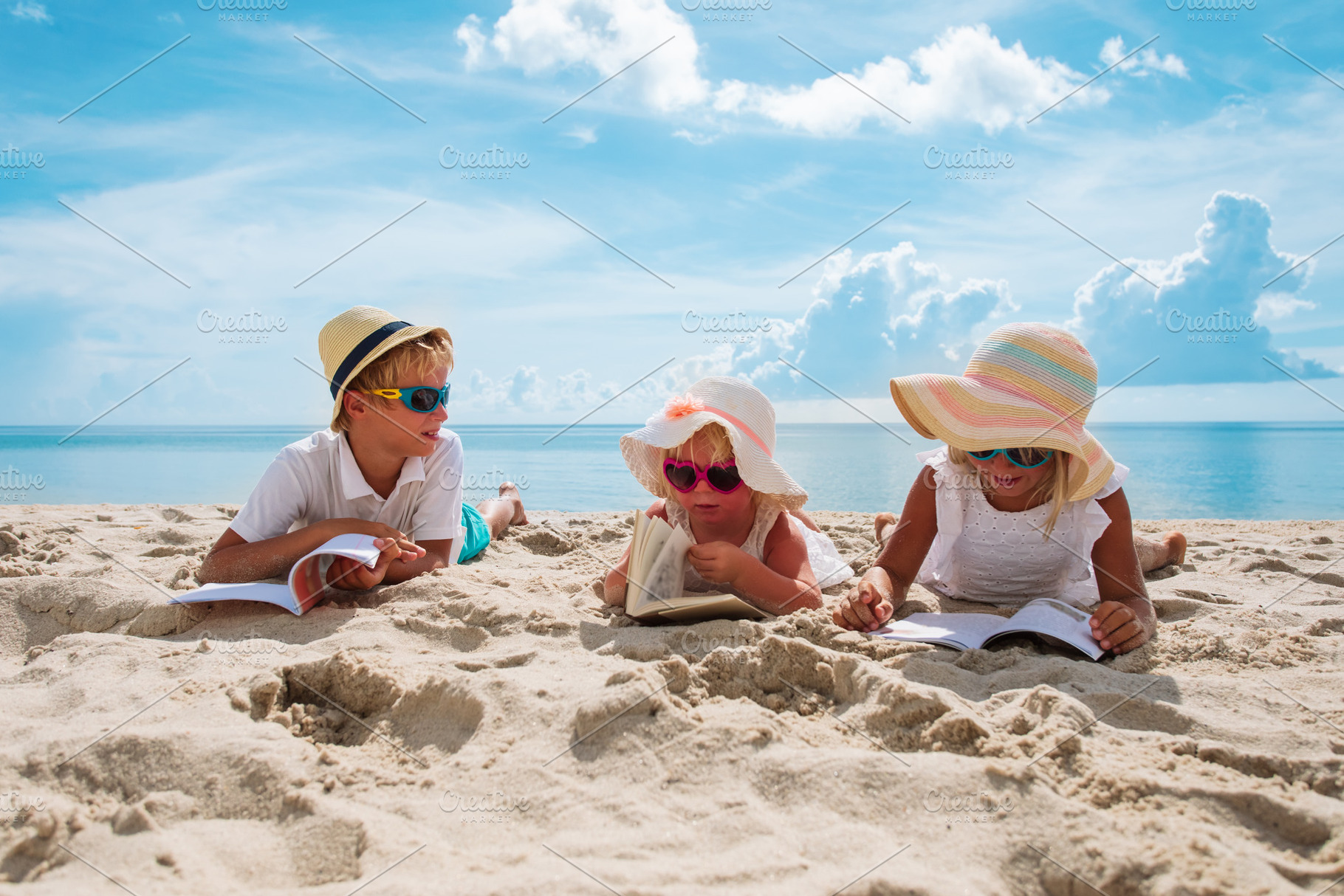Kids reading books at beach containing kid, read, and beach, a Person Photo by Nadezhda_Prokudina