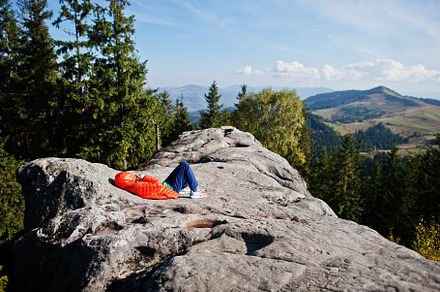 Children hiking on beautiful day in mountains, resting on rock a, a Nature Photo by AS photostudio