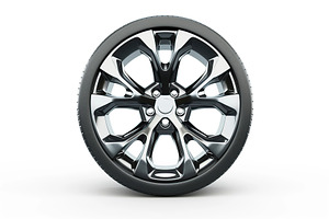 Car wheel with tire isolated on white background, a Transportation Photo by AlyaAnd