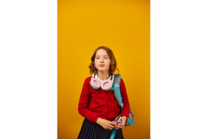 Young girl with headphones and a, a School & Education Photo by IlliaBondarPhotography