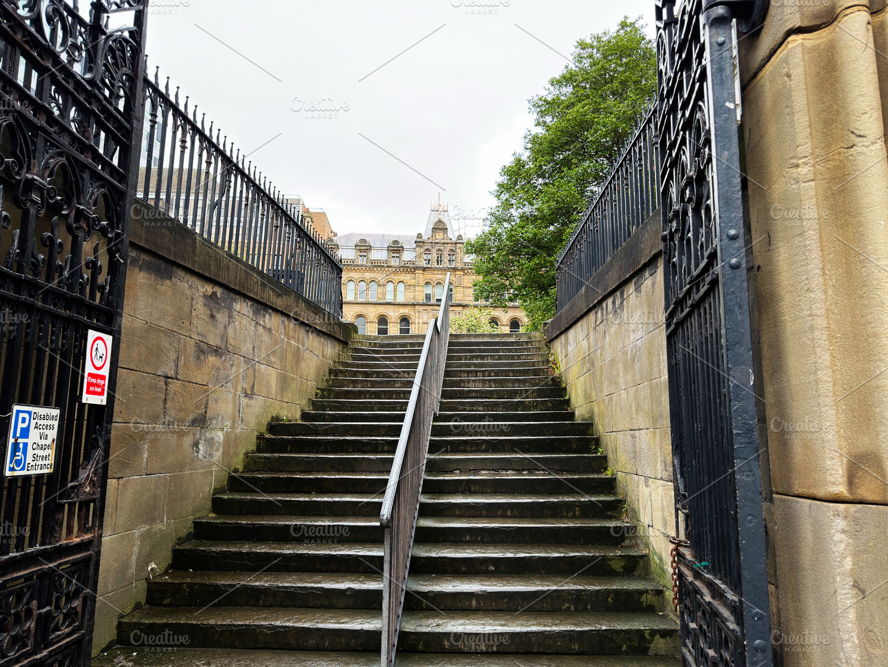 Stone steps and iron gate leading up to a historic sandstone bui, a Photo by AS photostudio