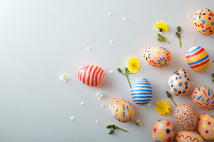 Scattered Painted Easter Eggs on Pastel Background, a Holiday Photo by Davizro's Market