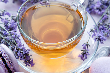 Cup of tea with macaroon dessert with lavender flavor, a Food & Drink Photo by Olena Rudo